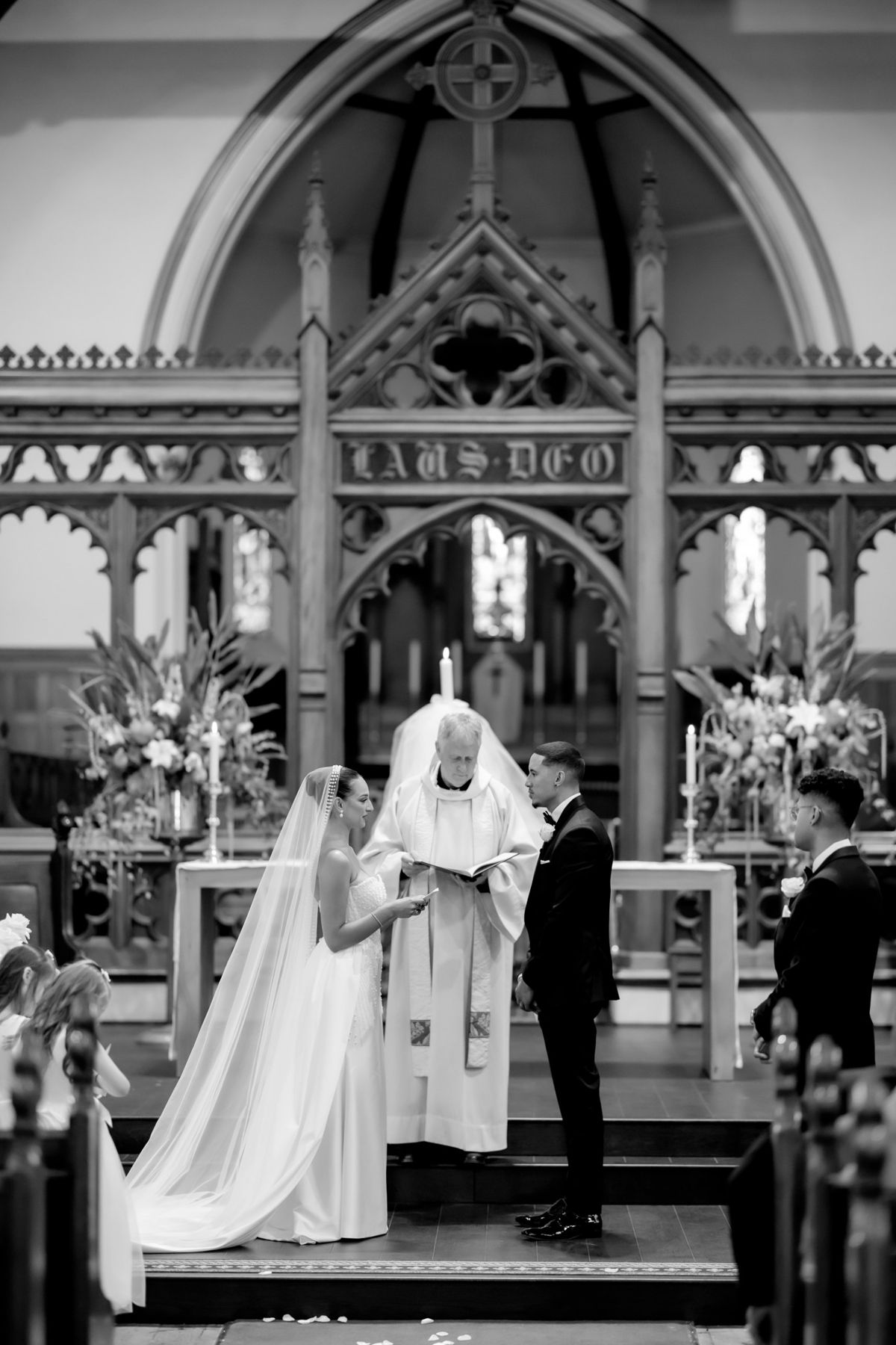 Couple exchanging vows at the church altar